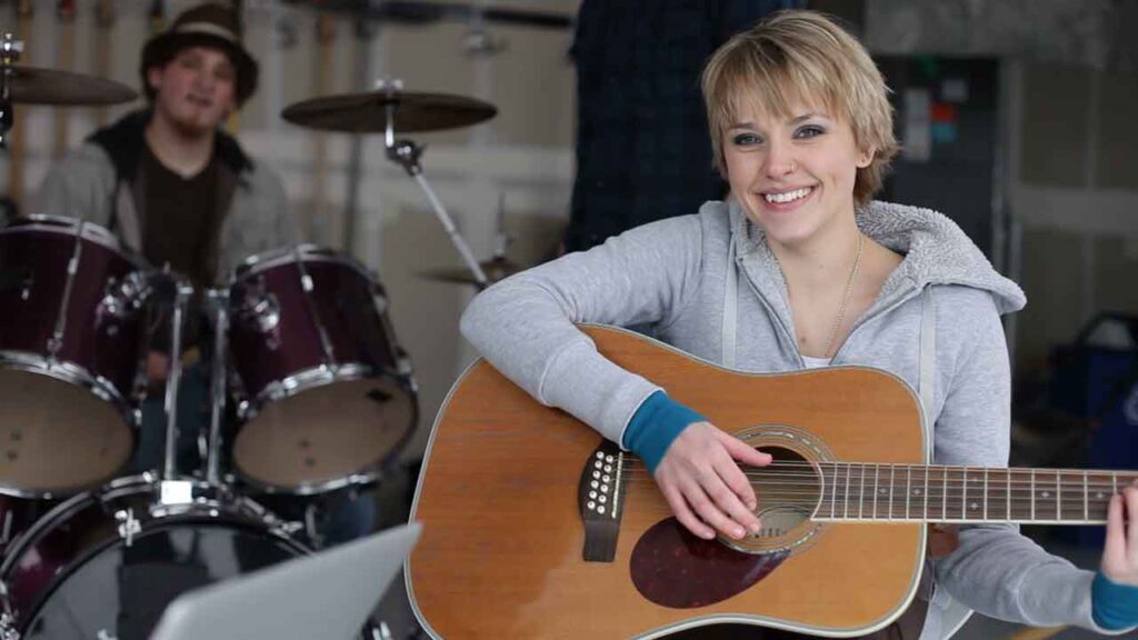 girl holding guitar